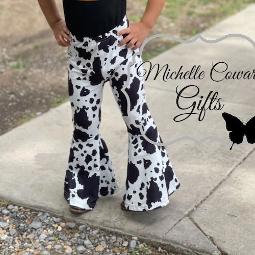 Step Out In Style With Trendy Plus Size Cow Print Bell Bottoms