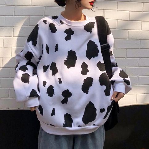 Get Cozy And Chic With Our Cow Print Fleece Pullover